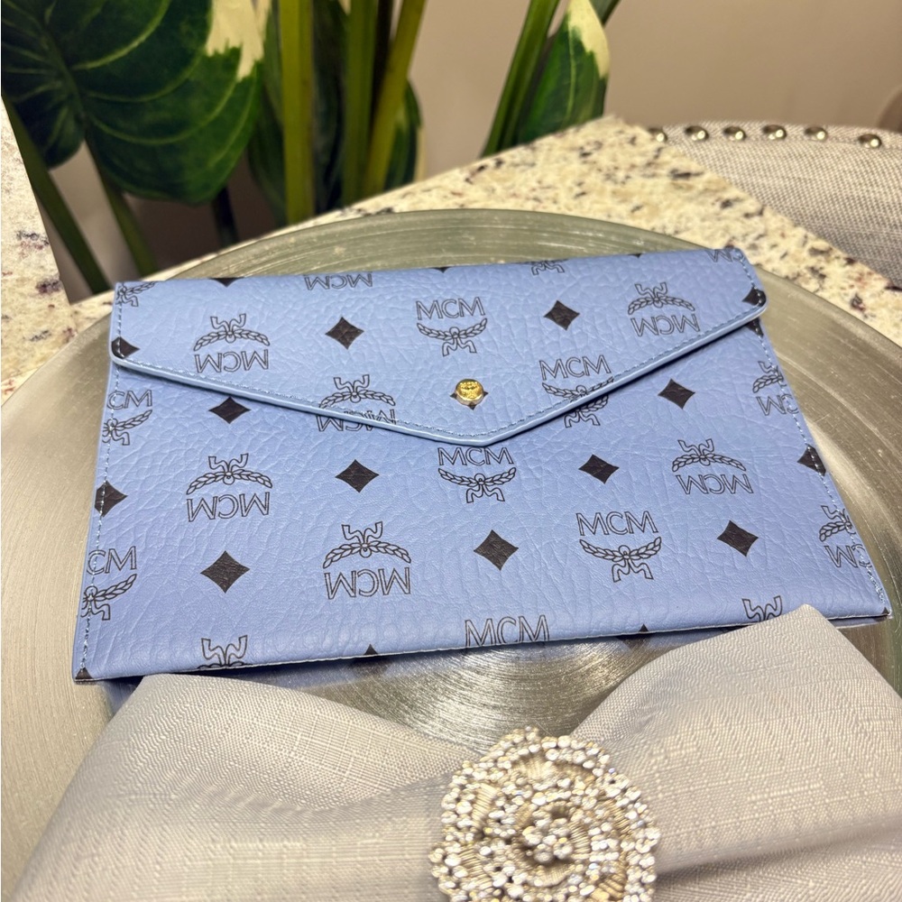 GWP: MCM Light Blue Monogram Envelope Clutch